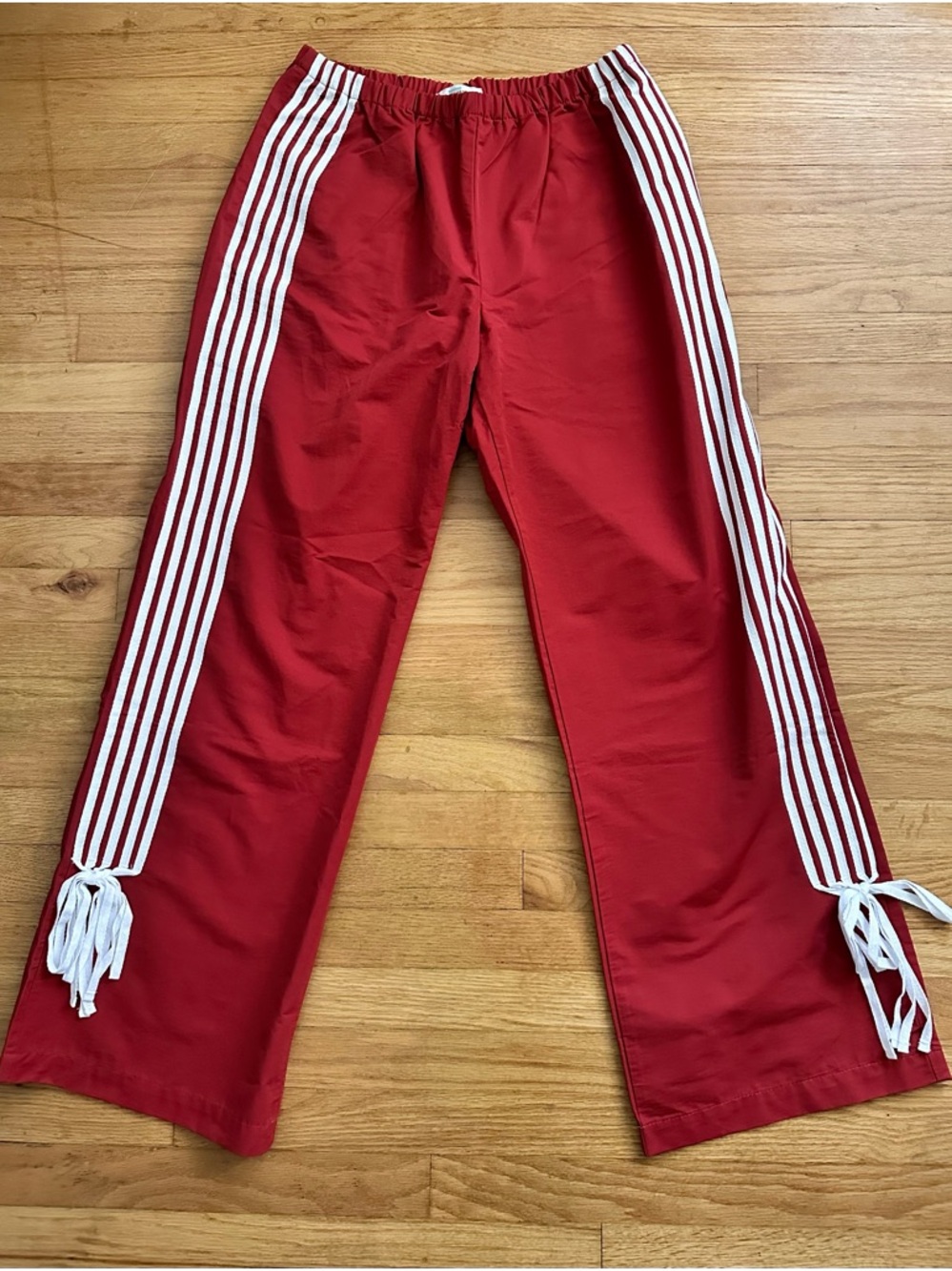 Red Track Pants with White Side Stripes and Bow Details